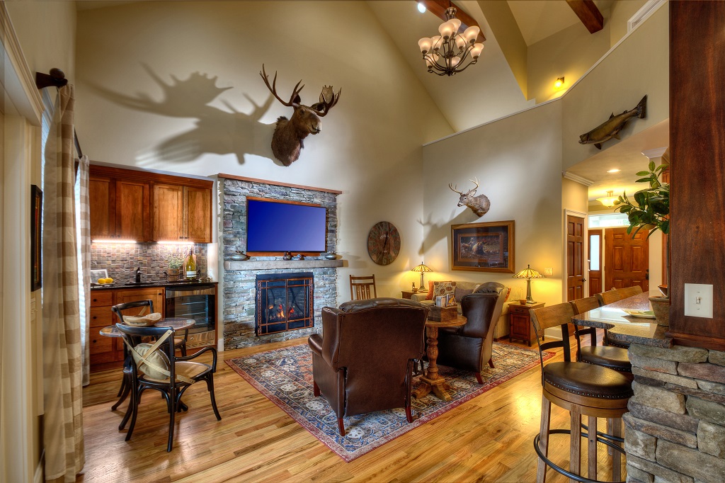 Rustic Main Level Great Room with plenty of seating to cozy up to the fireplace