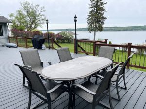 Spacious Deck with two seating areas overlooking the Lake